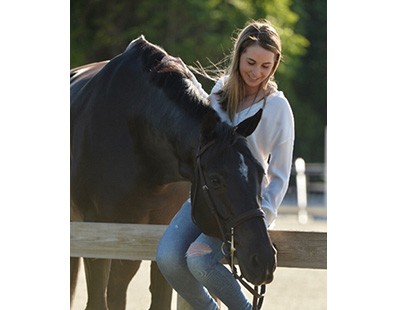 Madison Goetzmann petting horse