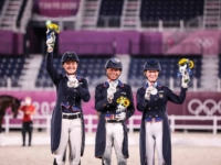 U.S. Dressage Team Silver Medalists Adrienne Lyle, Steffen Peters, and Sabine Schut-Kery at the 2020 Tokyo Olympic Games. Photo by Annan Hepner/Phelps Media Group U.S. Dressage Team Silver Medalists Adrienne Lyle, Steffen Peters, and Sabine Schut-Kery at the 2020 Tokyo Olympic Games. Photo by Annan Hepner/Phelps Media Group