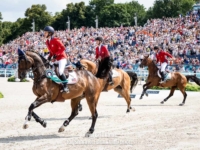 U.S. Jumping Team Silver Medalists Laura Kraut on Baloutinue, McLain Ward on Ilex, and Karl Cook with Caracole de la Roque in the victory gallop at the 2024 Paris Olympic Games. Photo by Roya Brinkman for Shannon Brinkman Photo U.S. Jumping Team Silver Medalists Laura Kraut on Baloutinue, McLain Ward on Ilex, and Karl Cook with Caracole de la Roque in the victory gallop at the 2024 Paris Olympic Games. Photo by Roya Brinkman for Shannon Brinkman Photo